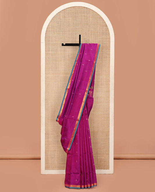Rani Pink Uppada Silk Saree Beautified with Paisley Buttas, Captivating Contrast Bavanji Border, Pallu Featuring Floral and Paisley Design, and Paired with a Matching Blouse