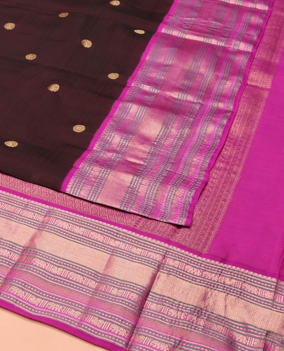 Brown Vasundhara Lite-Silk Mix Saree, Enriched with Zari Buttas on Its Body, Complemented by a Contrast Border of Thilakam Mokku, Mayil, Yaanai, and Mayil Kann Designs, Gleaming Zari Pallu of Jaal Designs, and Paired with a Contrast Blouse