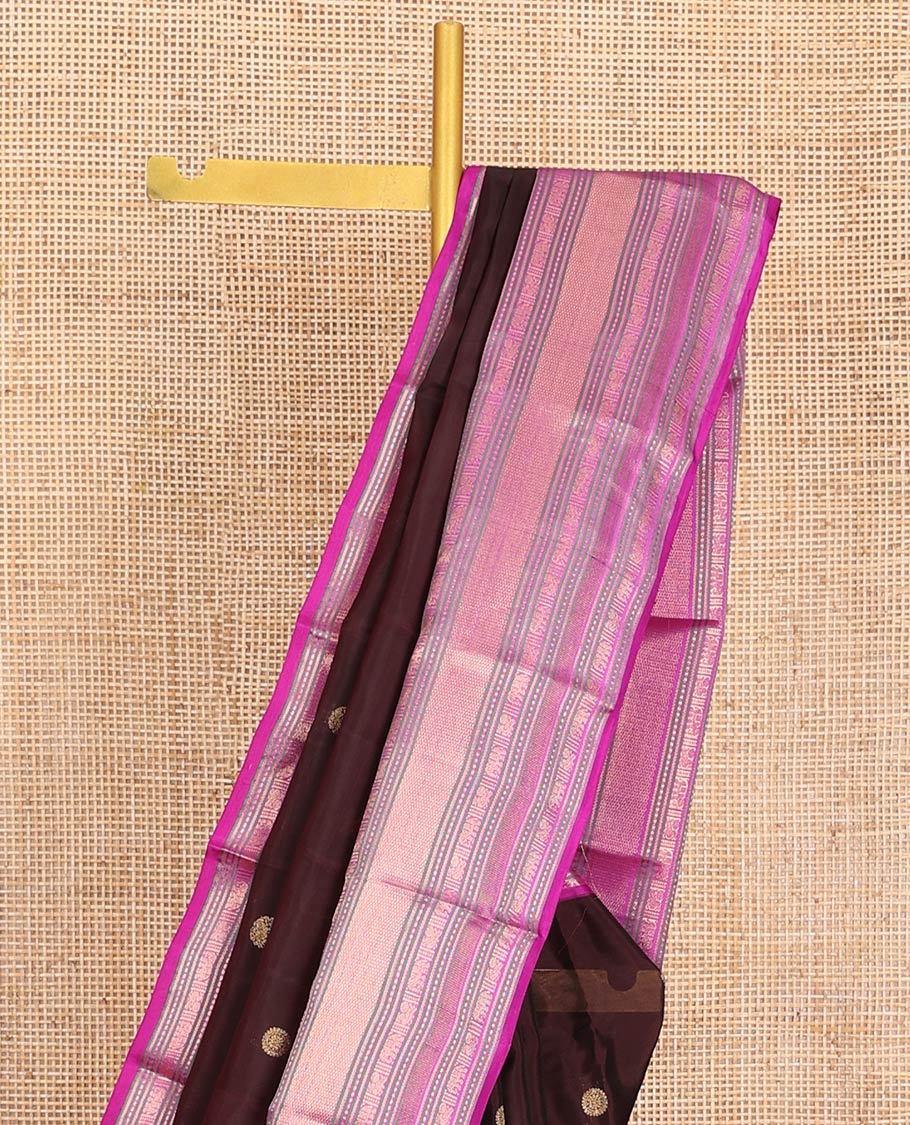 Brown Vasundhara Lite-Silk Mix Saree, Enriched with Zari Buttas on Its Body, Complemented by a Contrast Border of Thilakam Mokku, Mayil, Yaanai, and Mayil Kann Designs, Gleaming Zari Pallu of Jaal Designs, and Paired with a Contrast Blouse