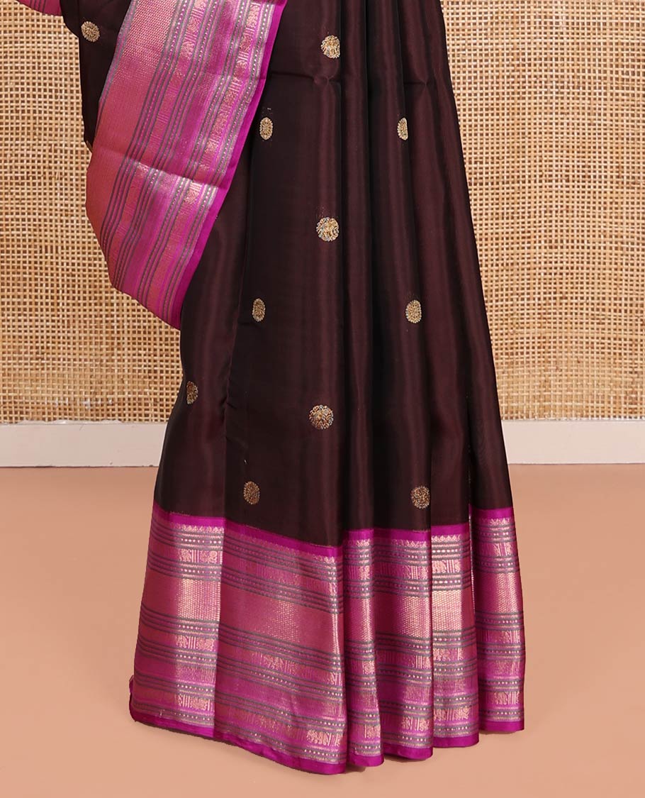 Brown Vasundhara Lite-Silk Mix Saree, Enriched with Zari Buttas on Its Body, Complemented by a Contrast Border of Thilakam Mokku, Mayil, Yaanai, and Mayil Kann Designs, Gleaming Zari Pallu of Jaal Designs, and Paired with a Contrast Blouse
