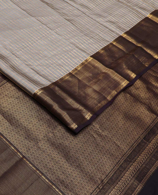 Grey zari striped Vasundhara silk mix saree, contrast zari border of muthu stripes, and zari-rich pallu