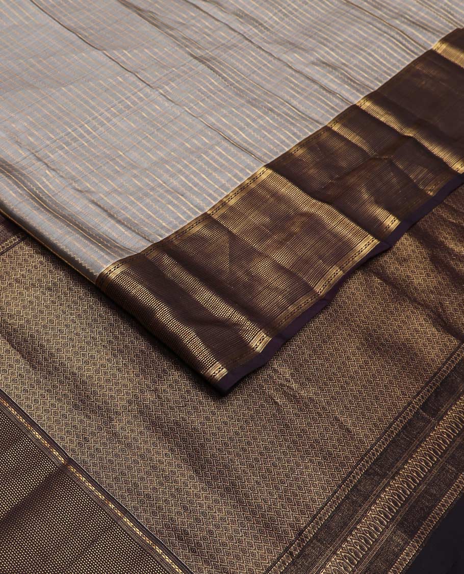 Grey zari striped Vasundhara silk mix saree, contrast zari border of muthu stripes, and zari-rich pallu