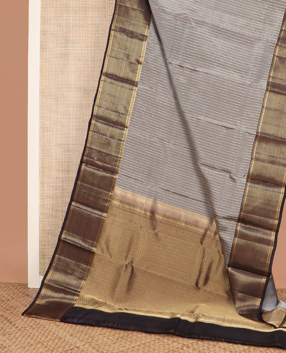 Grey zari striped Vasundhara silk mix saree, contrast zari border of muthu stripes, and zari-rich pallu