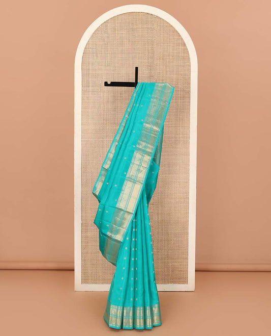 Blue zari buttas Vasundhara silk mix saree, zari border of rekku, kodi visiry, and kuyil kann designs, and jaal pallu