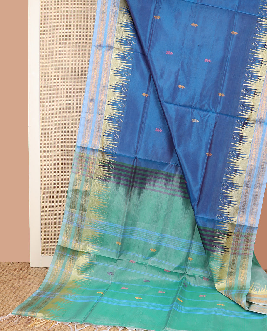 Blue buttas banana pith saree, contrast temple traditional zari border, and contrast striped pallu