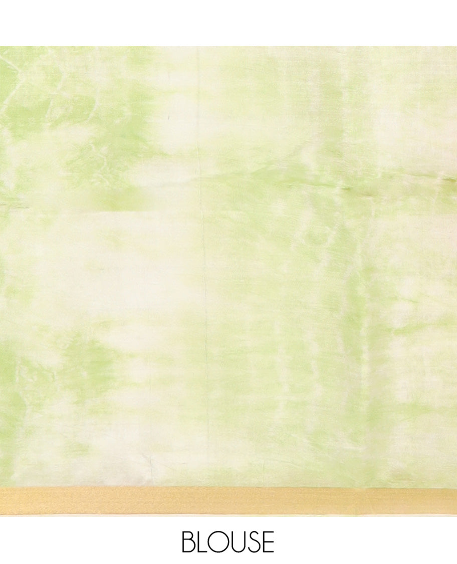 Green Banana Pith Saree Subtly Sparkled with Shibori Prints, Zari Bavanji Border, Complemented with a Contrast Printed Pallu of Shibori Motifs, and Paired with a Contrast Shibori Printed Blouse