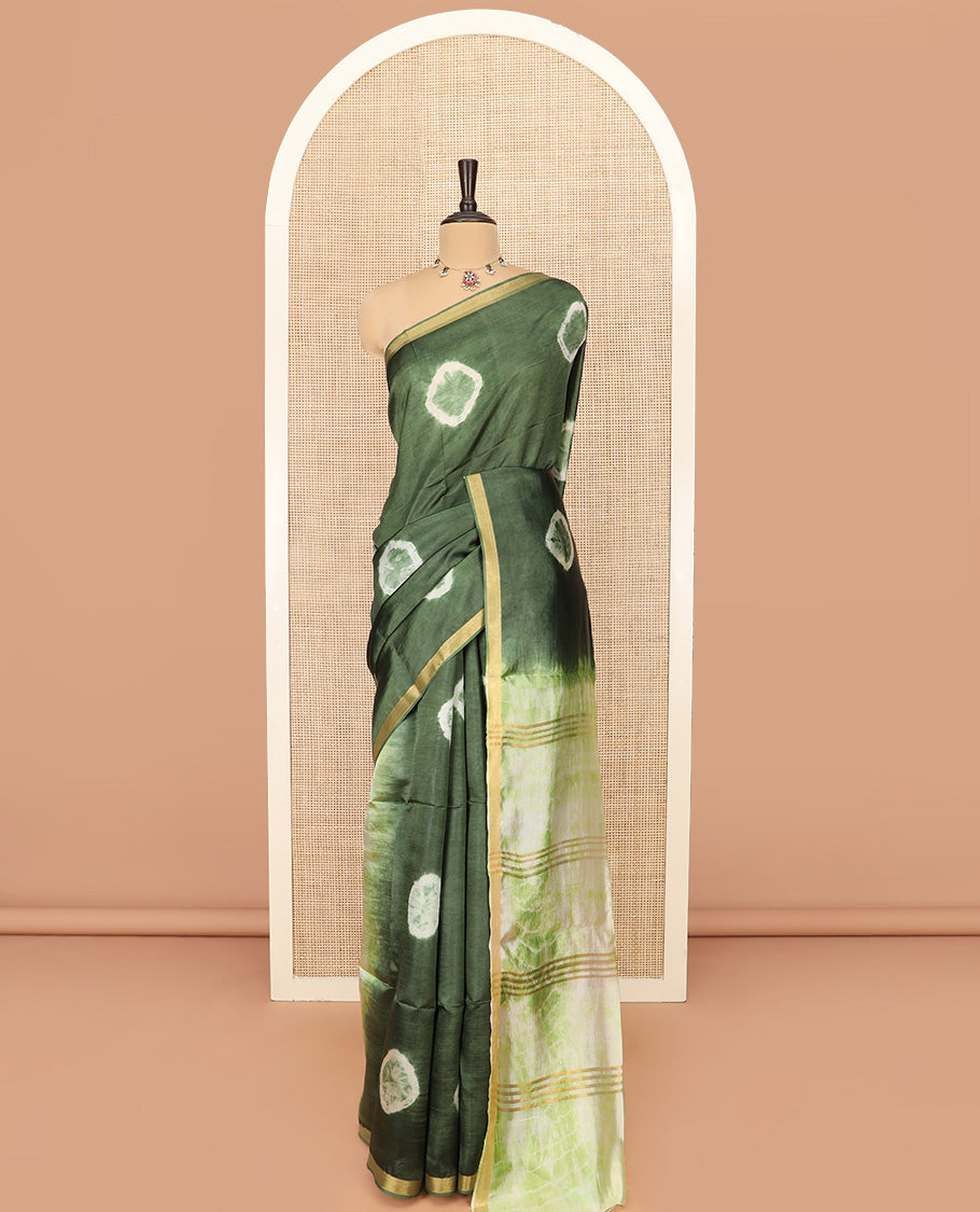 Green Banana Pith Saree Subtly Sparkled with Shibori Prints, Zari Bavanji Border, Complemented with a Contrast Printed Pallu of Shibori Motifs, and Paired with a Contrast Shibori Printed Blouse