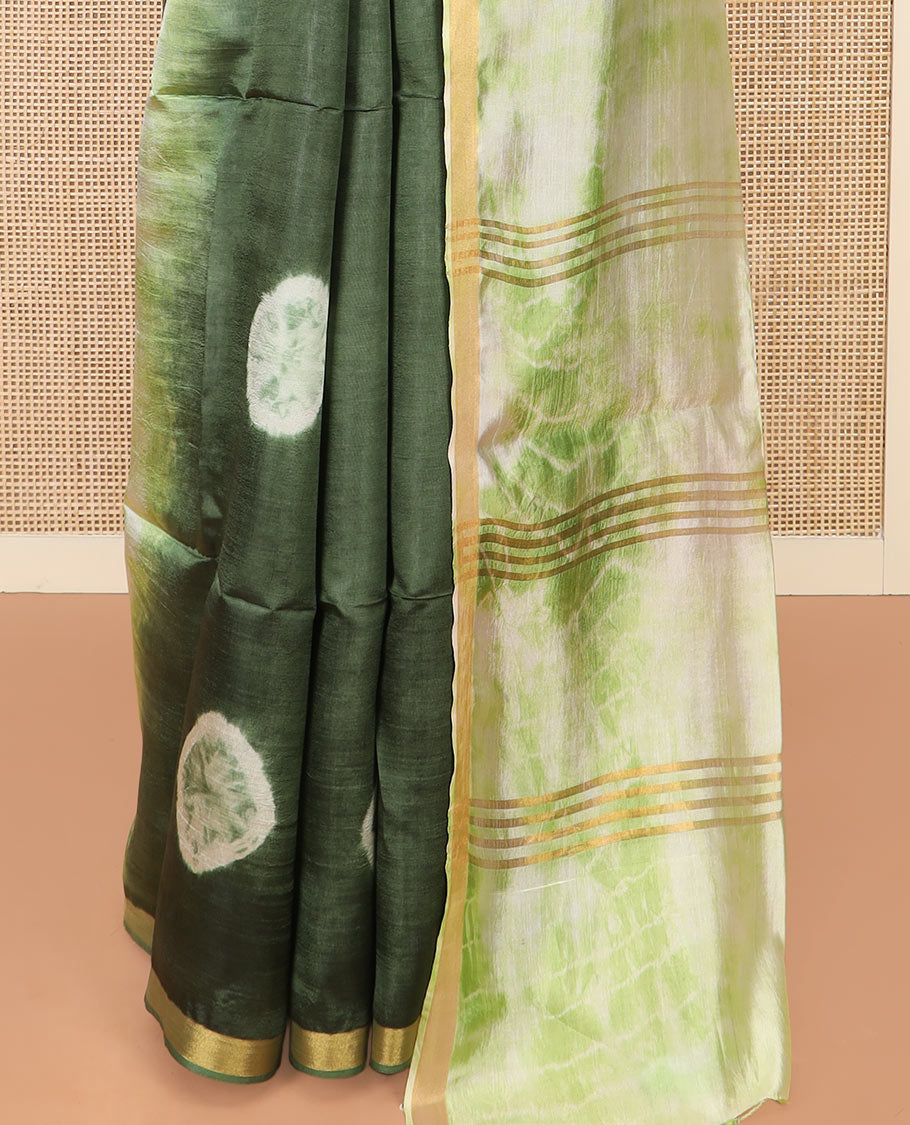 Green Banana Pith Saree Subtly Sparkled with Shibori Prints, Zari Bavanji Border, Complemented with a Contrast Printed Pallu of Shibori Motifs, and Paired with a Contrast Shibori Printed Blouse