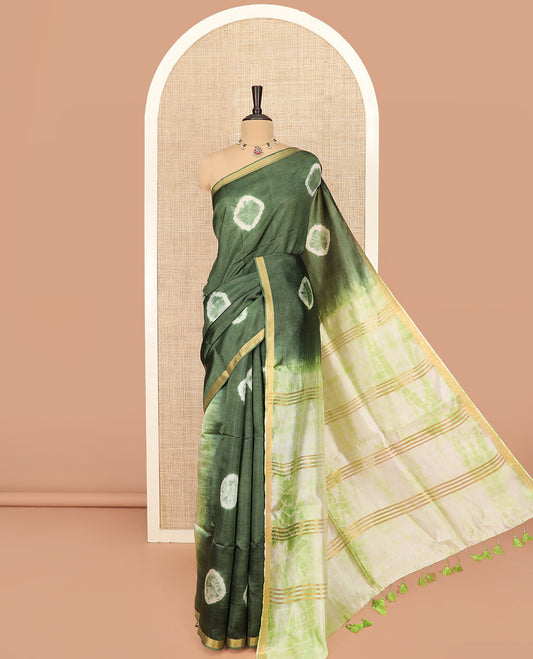 Green Banana Pith Saree Subtly Sparkled with Shibori Prints, Zari Bavanji Border, Complemented with a Contrast Printed Pallu of Shibori Motifs, and Paired with a Contrast Shibori Printed Blouse