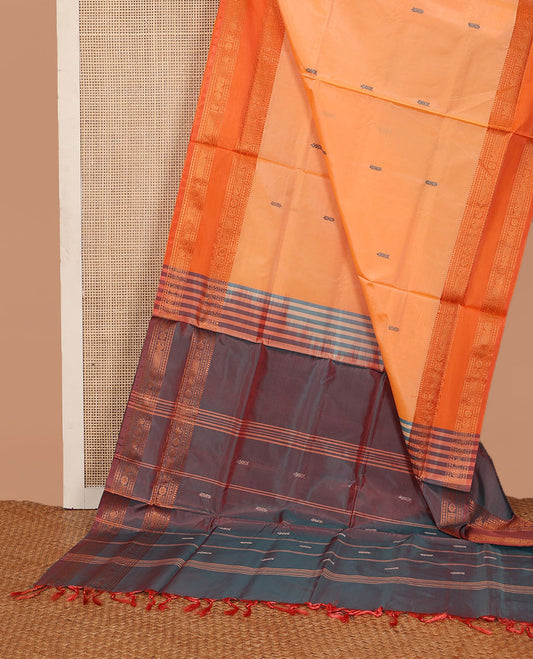Orange thread buttas banana pith saree, contrast traditional zari border, and contrast pallu of stripes, and buttas