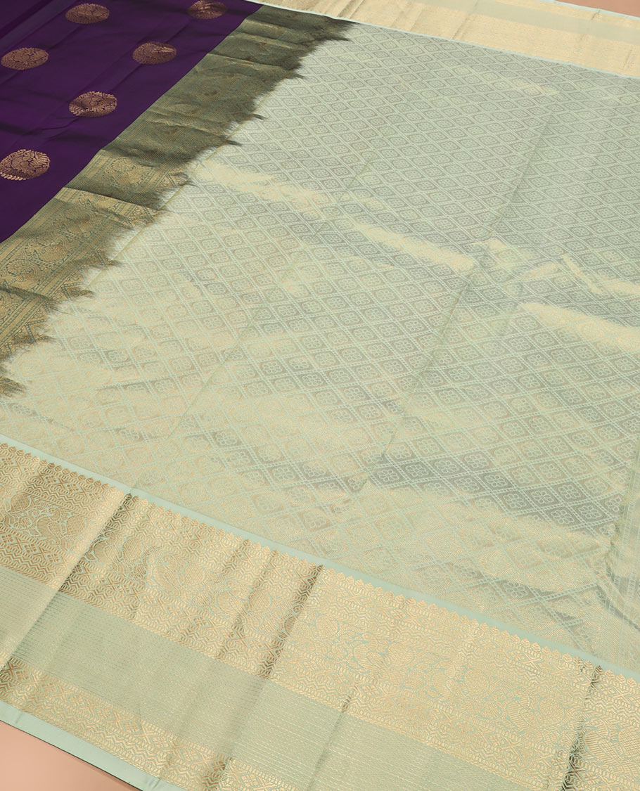 Violet round mayil buttas silk saree, contrast korvai border of thilakam, muthu, diamond, neli, mayil, and diamond designs, and jaal pallu
