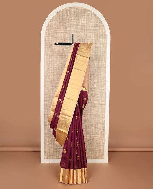 Maroon floral buttas silk saree, contrast border of salangai, ara bogudi, mayil kann & kodi visiry & seppu rekku pallu of floral motifs