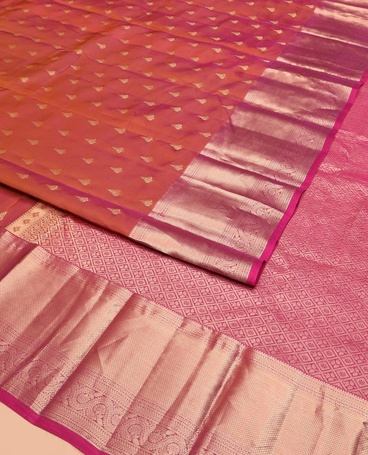 Orange Vasundhara Silk Saree Highlighted with Zari Buttas, Complemented by a Contrast Border of Rekku, Kathir, Mayil Kann, and Dhavana Kodi Designs, Grandly Woven Pallu of Jaal Designs, and a Contrast Blouse