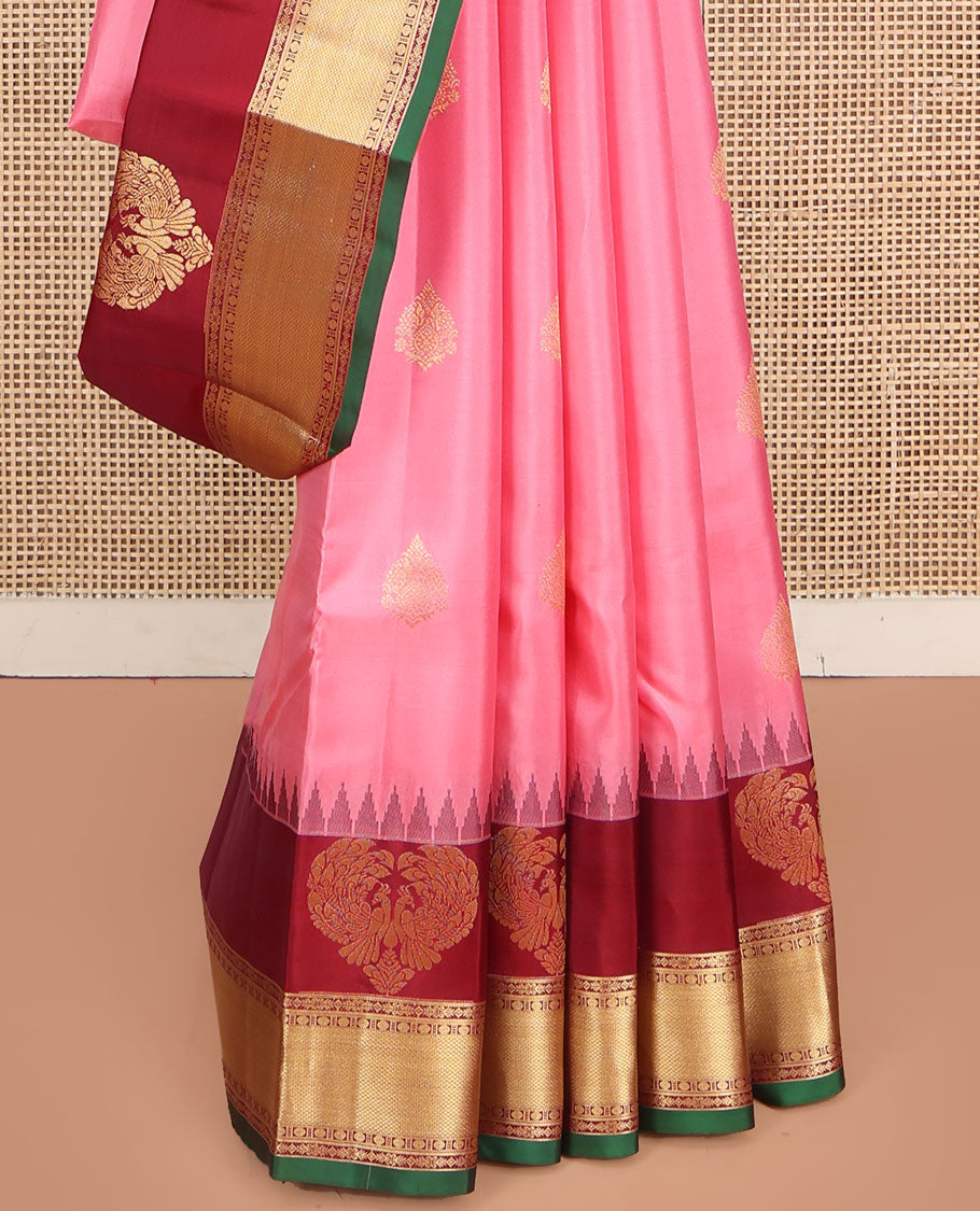 Pink Vasundhara Silk Saree, Finely Designed with Zari Buttas All Over Its Body, Complemented by Contrast Temple Border of Mayil, Rudraksham, and Mayil Kann Designs, Grand Jaal Pallu, and Paired with a Contrast Blouse