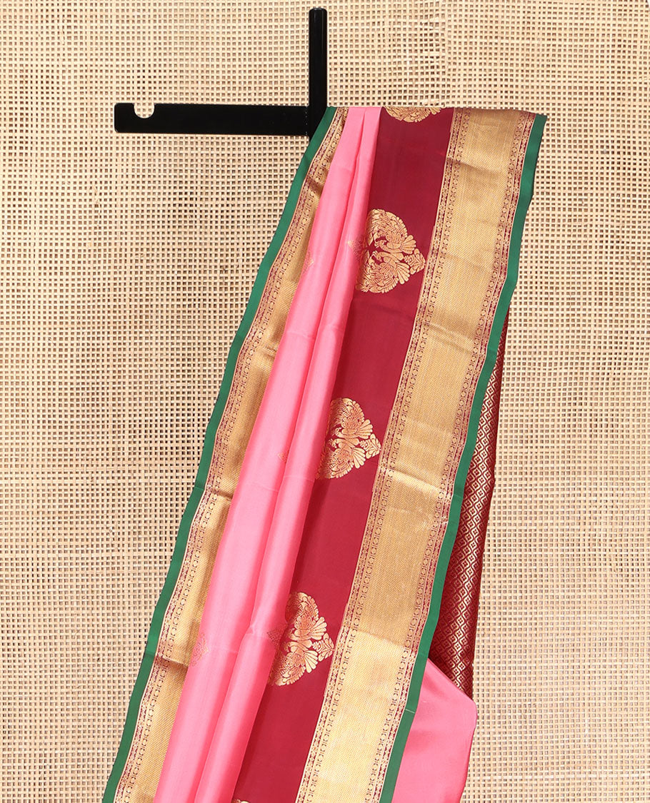 Pink Vasundhara Silk Saree, Finely Designed with Zari Buttas All Over Its Body, Complemented by Contrast Temple Border of Mayil, Rudraksham, and Mayil Kann Designs, Grand Jaal Pallu, and Paired with a Contrast Blouse