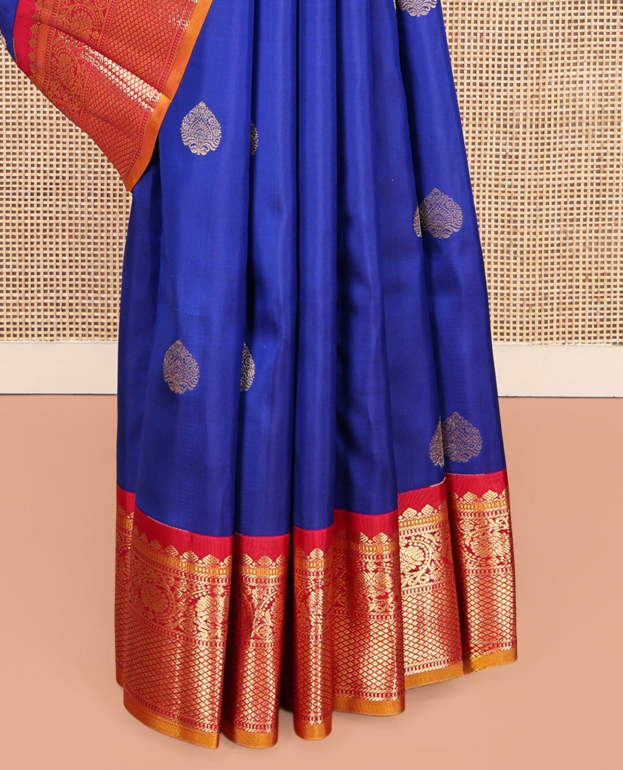 Royal Blue Vasundhara Silk Saree, Decorated with Zari Buttas, a Contrast Border of Thilakam Mokku, Muthu, Banaras, Kodi Visiry, and Mayil Kann Designs, Grand Pallu, and a Contrast Blouse