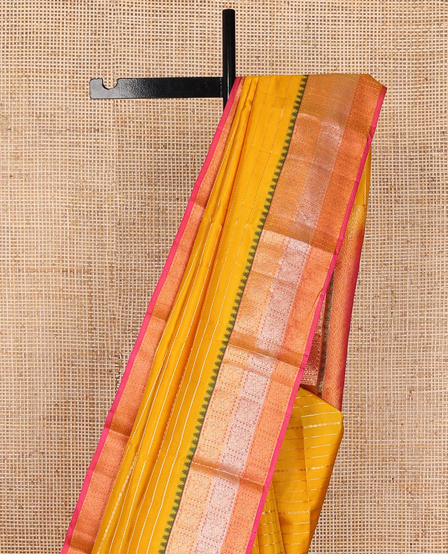 Yellow zari buttas silk saree, contrast ogee patterned pallu &  floral jaal enclosed checked thazampoo rekku border