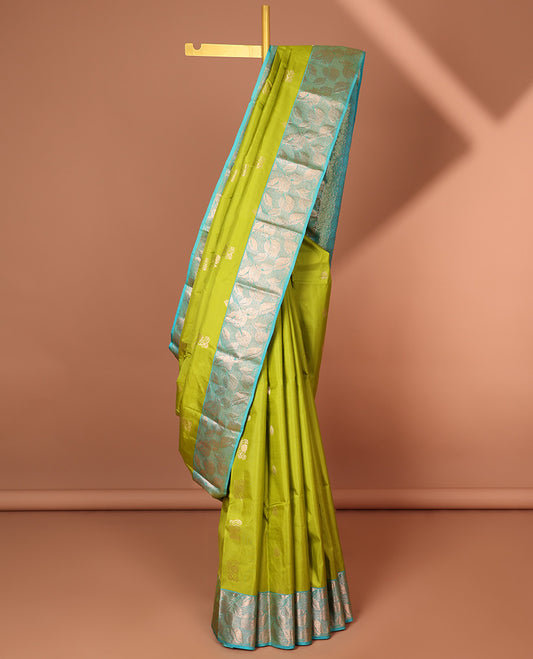 Green floral buttas silk saree with contrast leaf design border &  intricate jaal zari design pallu