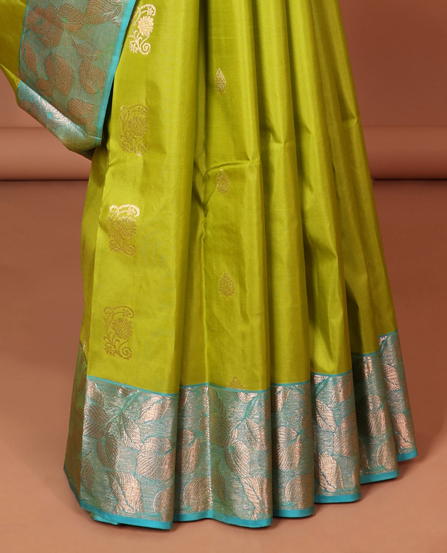 Green floral buttas silk saree with contrast leaf design border &  intricate jaal zari design pallu