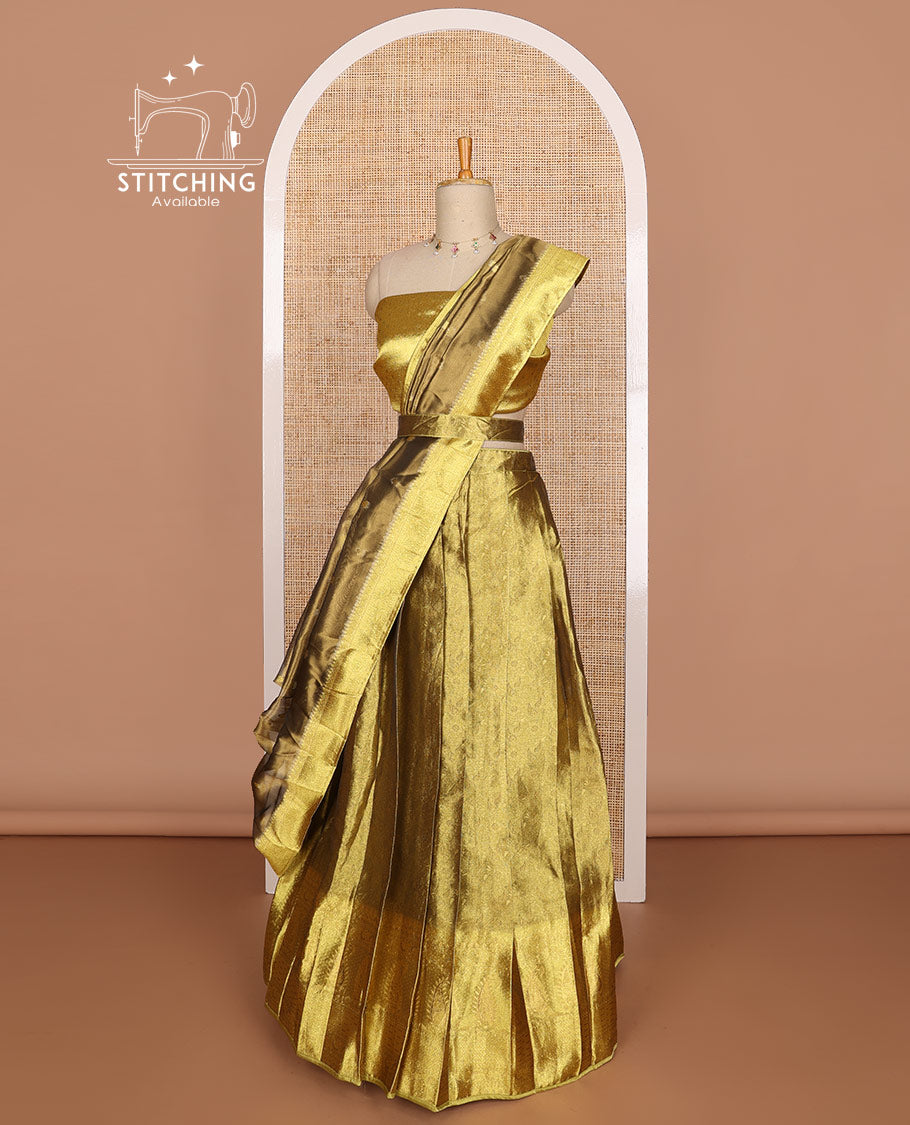 Gold color floral design tissue half saree with contrast zari design border, zari design blouse & floral design dhavani