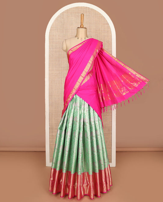 Pista green art silk half saree, jacquard with contrast traditional zari border skirt, jacquard contrast blouse and zari woven dhavani