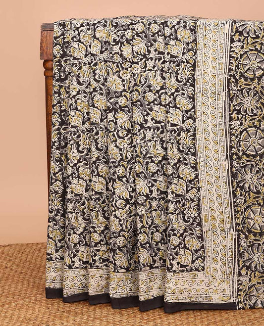 Black floral vine machine-printed Kalamkari cotton saree, geometric printed border, and pallu of floral-geometric print