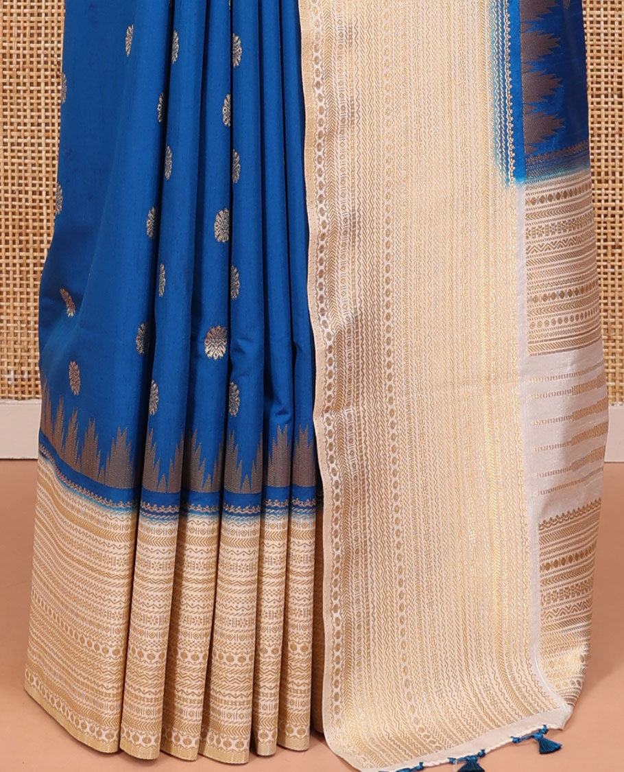 Peacock Blue Dupion Silk Saree, Ornamented with Zari Buttas All Over Its Body, Complemented by a Contrast Temple Traditional Zari Design Woven Border, Traditional Pallu of Temple Designs, and Paired with a Contrast Blouse