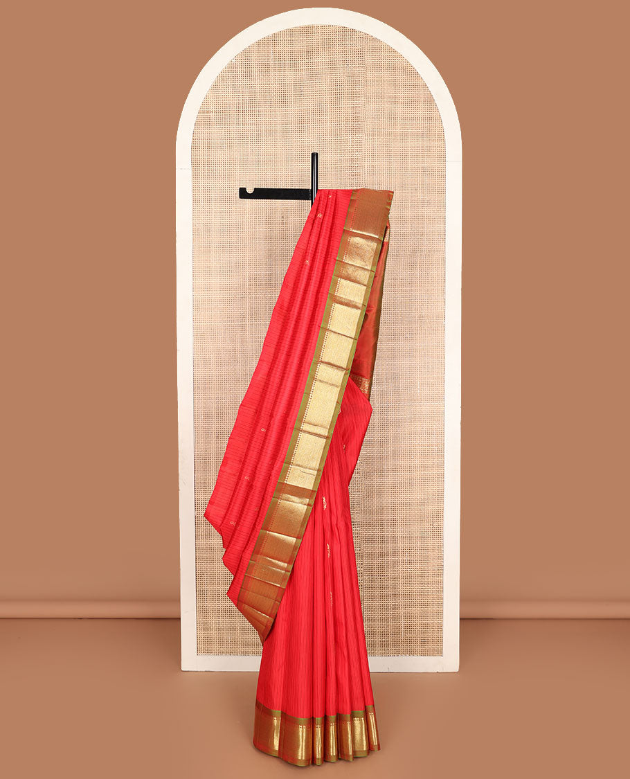 Red striped and zari buttas Kanchipuram silk saree, contrast one-sided border of paneer sombu, banars, and mayil kann designs, and zari design pallu