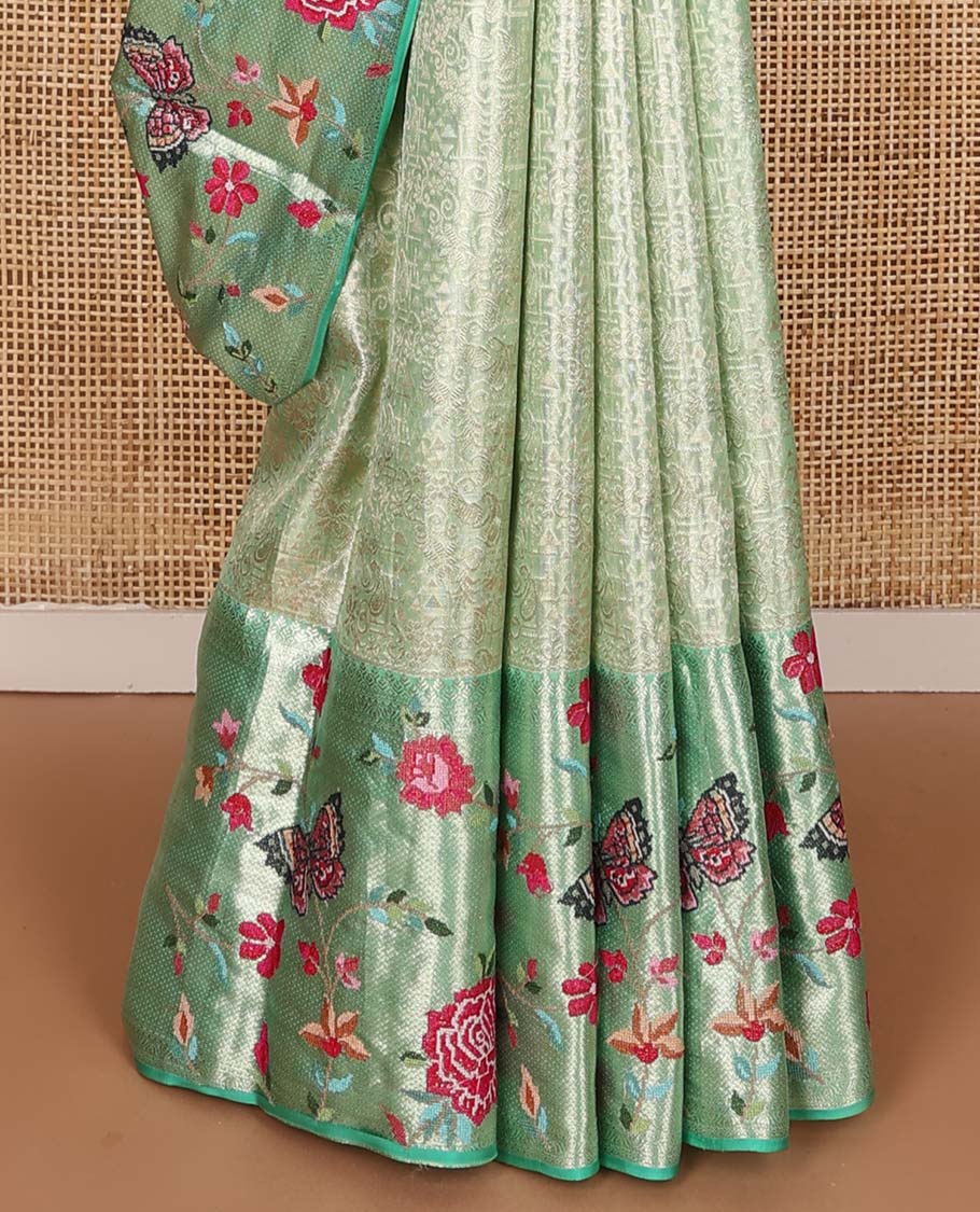 Pista green jacquard Kanchipuram silk saree, contrast traditional zari with meenakari floral vine, and butterflies embroidered border, and jaal pallu