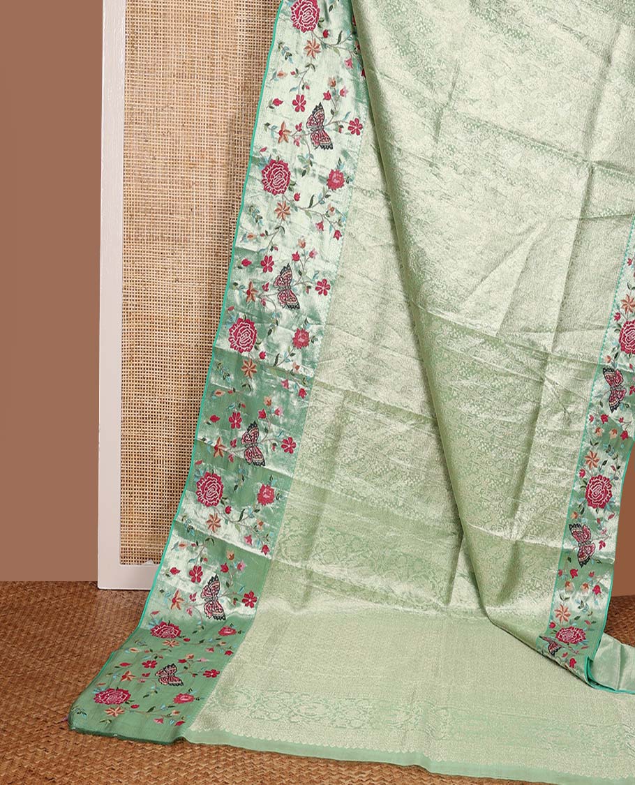 Pista green jacquard Kanchipuram silk saree, contrast traditional zari with meenakari floral vine, and butterflies embroidered border, and jaal pallu