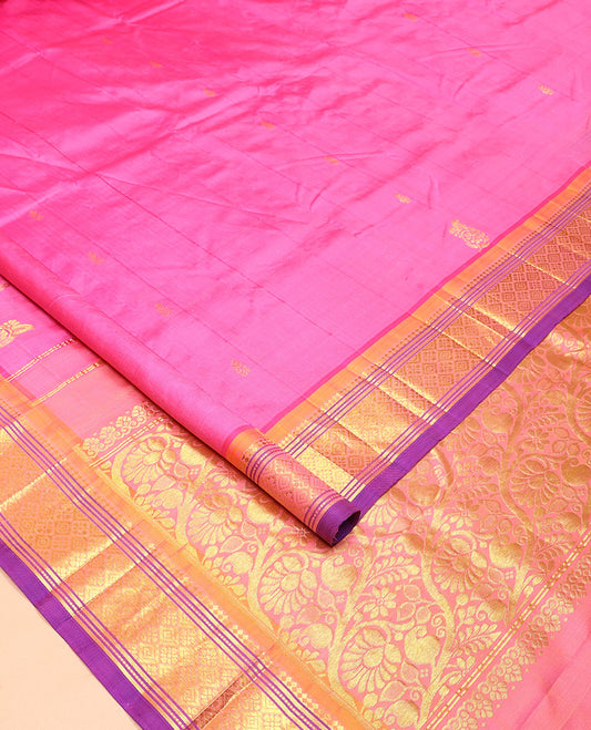 Pink Kanchipuram Silk Saree, Impeccably Styled with Zari Buttas All Over Its Body, Complemented by a Contrast One-Sided Border of Panner Sombu, Banaras, Muthu, and Jaal Designs, Pallu of Floral-Paisley Designs, and Comes Without a Blouse