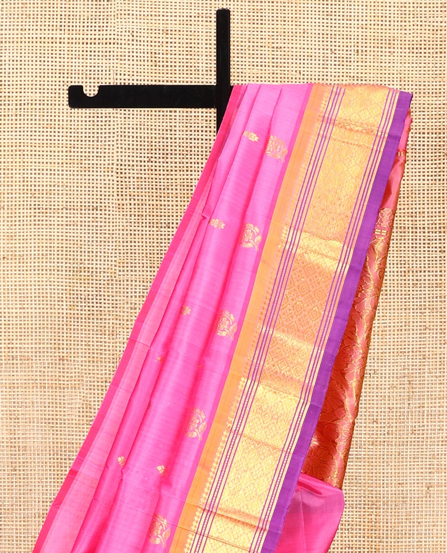 Pink Kanchipuram Silk Saree, Impeccably Styled with Zari Buttas All Over Its Body, Complemented by a Contrast One-Sided Border of Panner Sombu, Banaras, Muthu, and Jaal Designs, Pallu of Floral-Paisley Designs, and Comes Without a Blouse