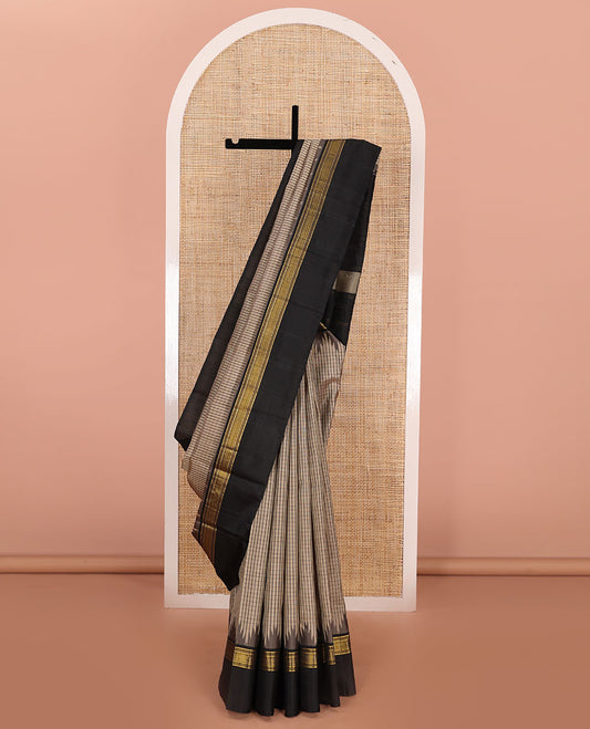 Beige checked Kanchipuram silk saree, contrast thazampoo rekku border of zari designs, and pallu of pillaiyar mokku designs