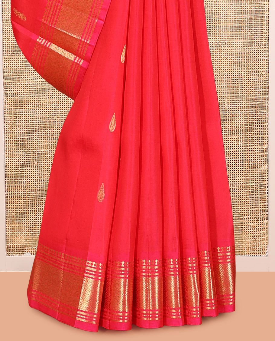 Red Kanchipuram Silk Saree, Decorated with Zari Buttas, Highlighted by a Zari Border of Panner Sombu, Banaras, Muthu, and Jaal Design, Pallu of Zari Design, and No Blouse