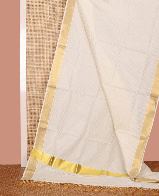 Cream Kerala Saree, Subtly Woven with Stripes on Its Body, Zari Bavanji Border, Sparkling Zari Woven Pallu, and Paired with a Matching Blouse