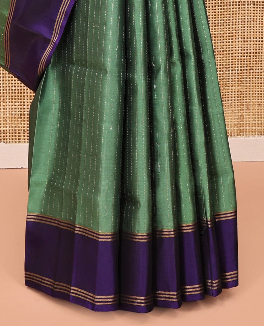 Green Mayuri Lite Silk Mix Saree, Sparsely Sparkled with Muthu Stripes on Its Body, Complemented by a Contrast Border, Jaal Pallu, and Paired with a Contrast Blouse
