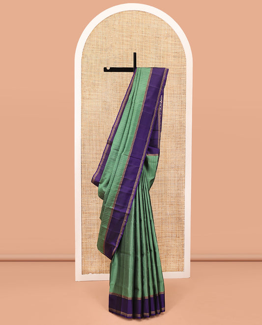 Green Mayuri Lite Silk Mix Saree, Sparsely Sparkled with Muthu Stripes on Its Body, Complemented by a Contrast Border, Jaal Pallu, and Paired with a Contrast Blouse