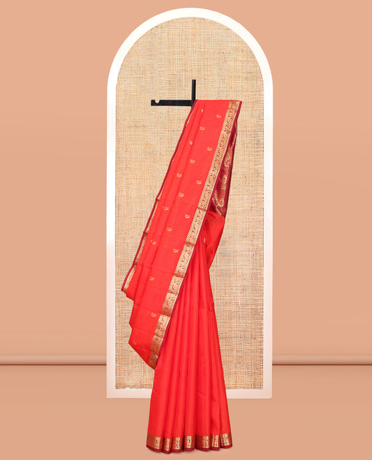 Orange Vasundhara Lite Silk Mix Saree, Gleamed Up with Zari Buttas, a Contrast Border of Manga, Kathir, Mayil, and Yaanai Designs, Grand Pallu, and a Contrast Blouse
