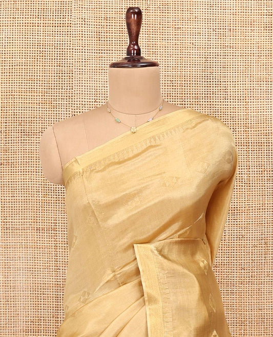 Sandal Banana Pith Saree, Subtly Sparkled with Buttas All Over Its Body, Subtle Border, Striped Pallu, and Paired with a Matching Blouse