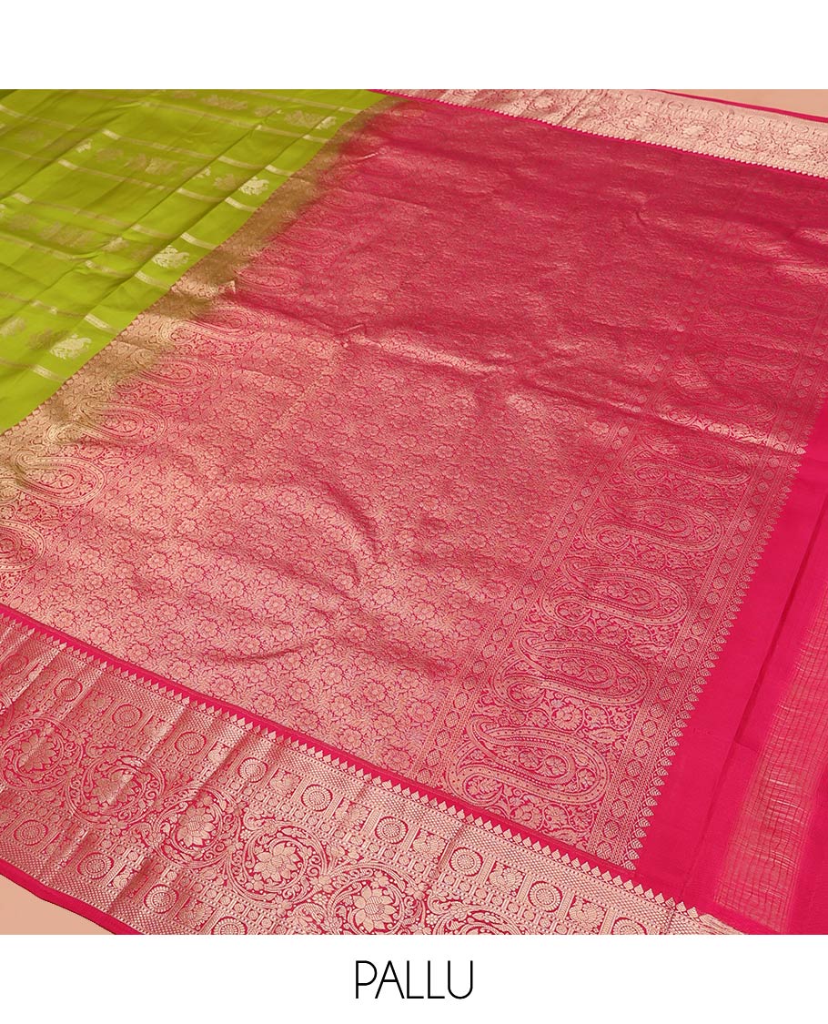 Parrot Green Vasundhara Silk Saree, Artfully Detailed with Zari Designs, Complemented by a Contrast Border of Thilakam Mokku, Muthu, Mayil, Chakra, Kuyil Kann, and Kodi Visiry Designs, Pallu of Floral Jaal Designs, and Paired with a Contrast Blouse