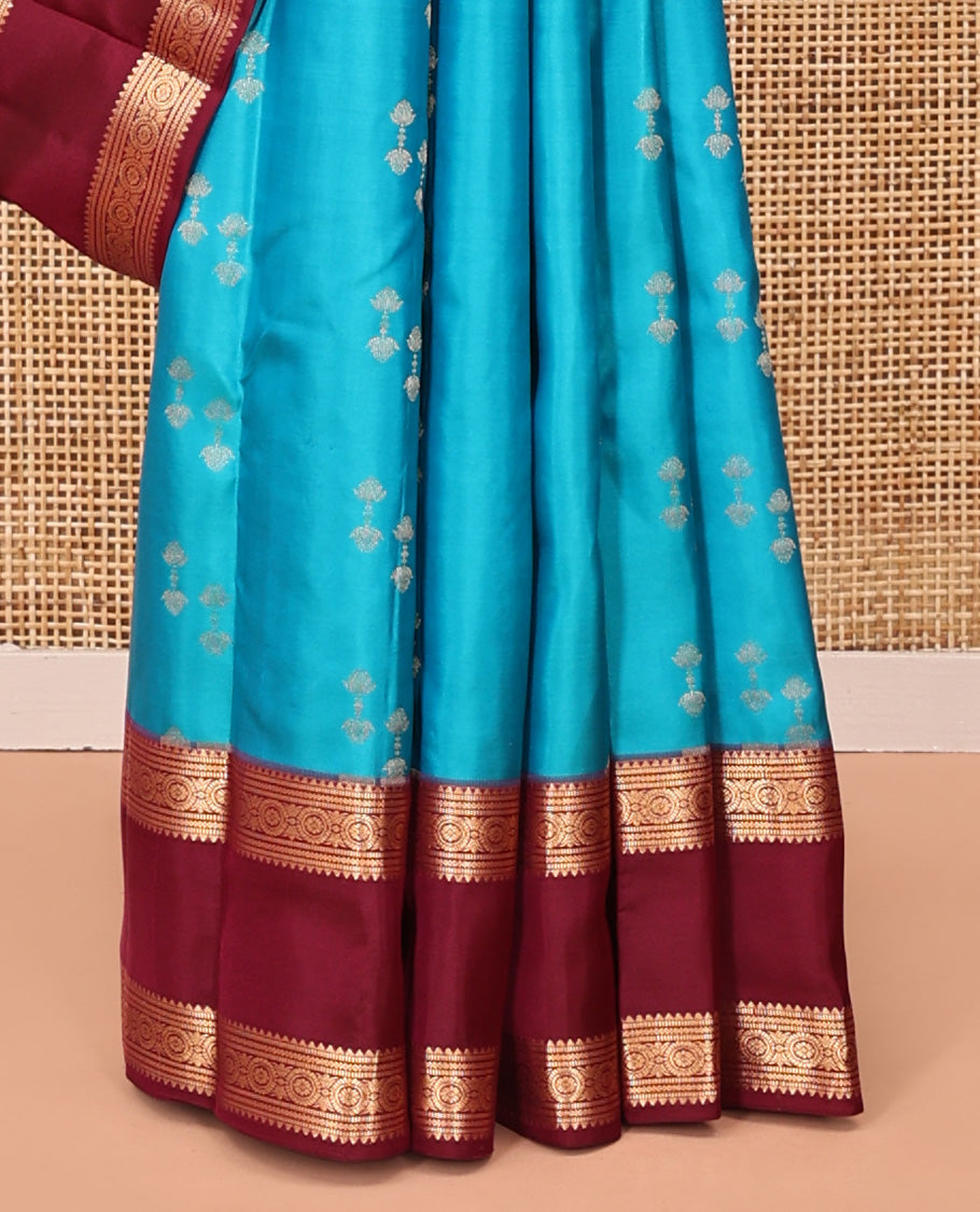 Blue Vasundhara Silk Saree, Graced with Zari Buttas All Over Its Body, Complemented by a Contrast Rettai Pettu Border of Rekku, Muthu, and Chakram Designs, Grand Pallu, and Paired with a Contrast Blouse