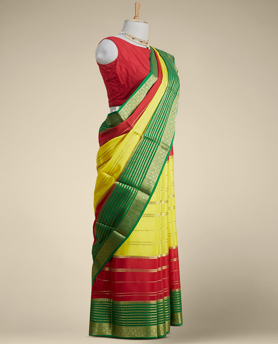 Yellow striped design mysore silk sare with contrast traditional zari border