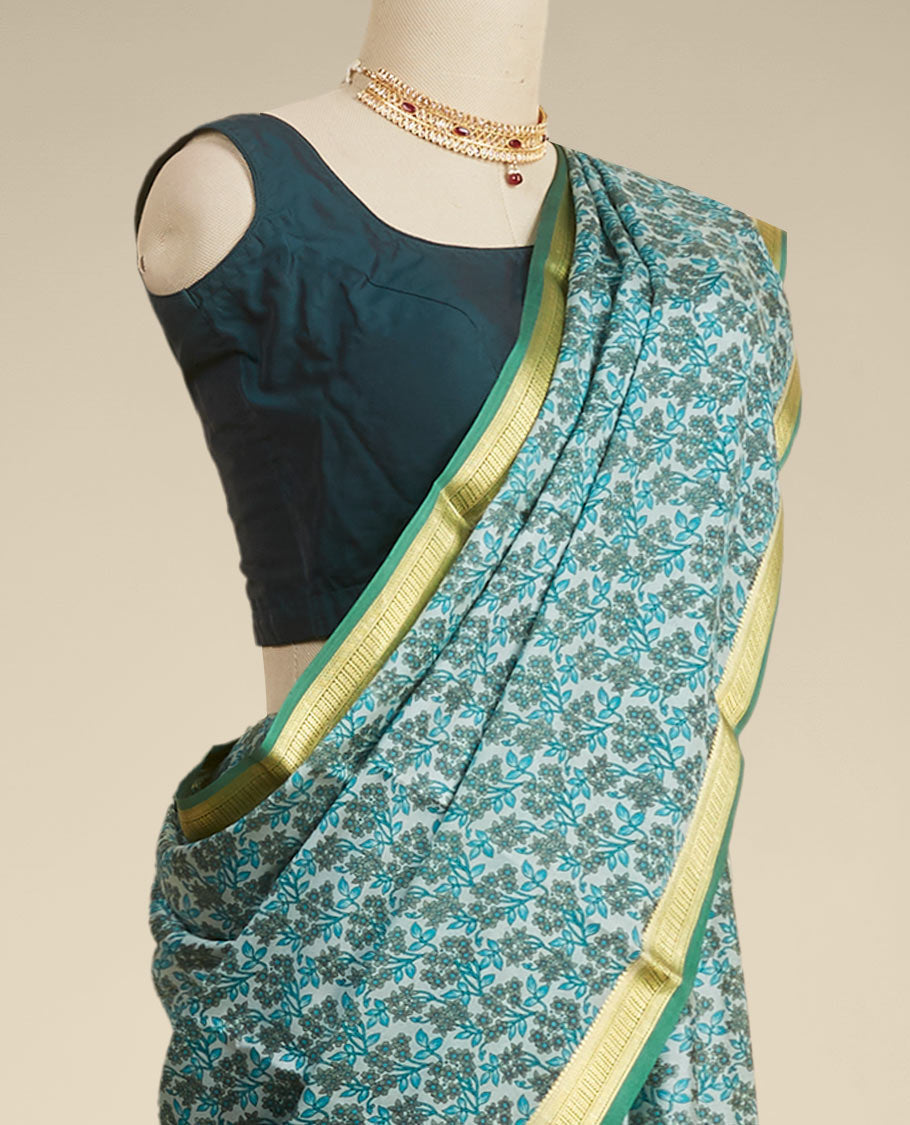 Green floral printed silk saree with contrast zari border