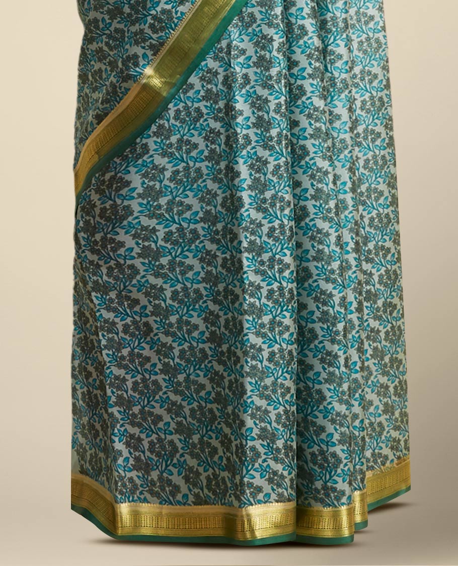 Green floral printed silk saree with contrast zari border