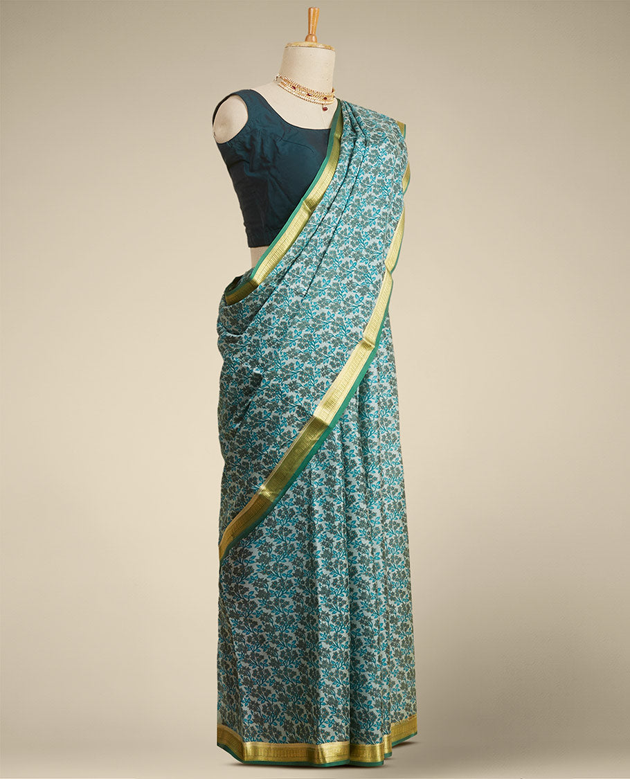 Green floral printed silk saree with contrast zari border