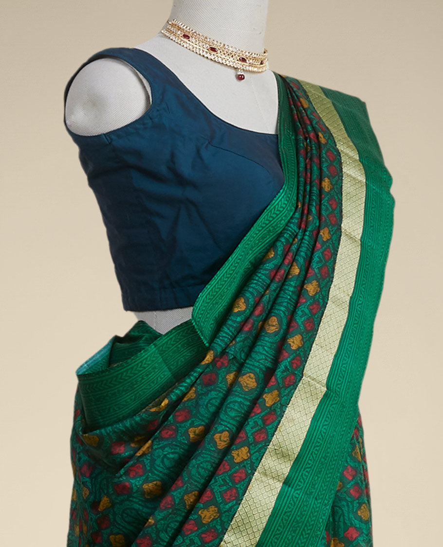 Green geometric printed silk saree with contrast intricate design border