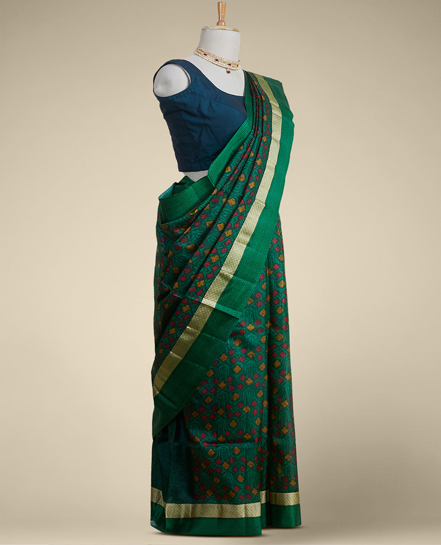 Green geometric printed silk saree with contrast intricate design border