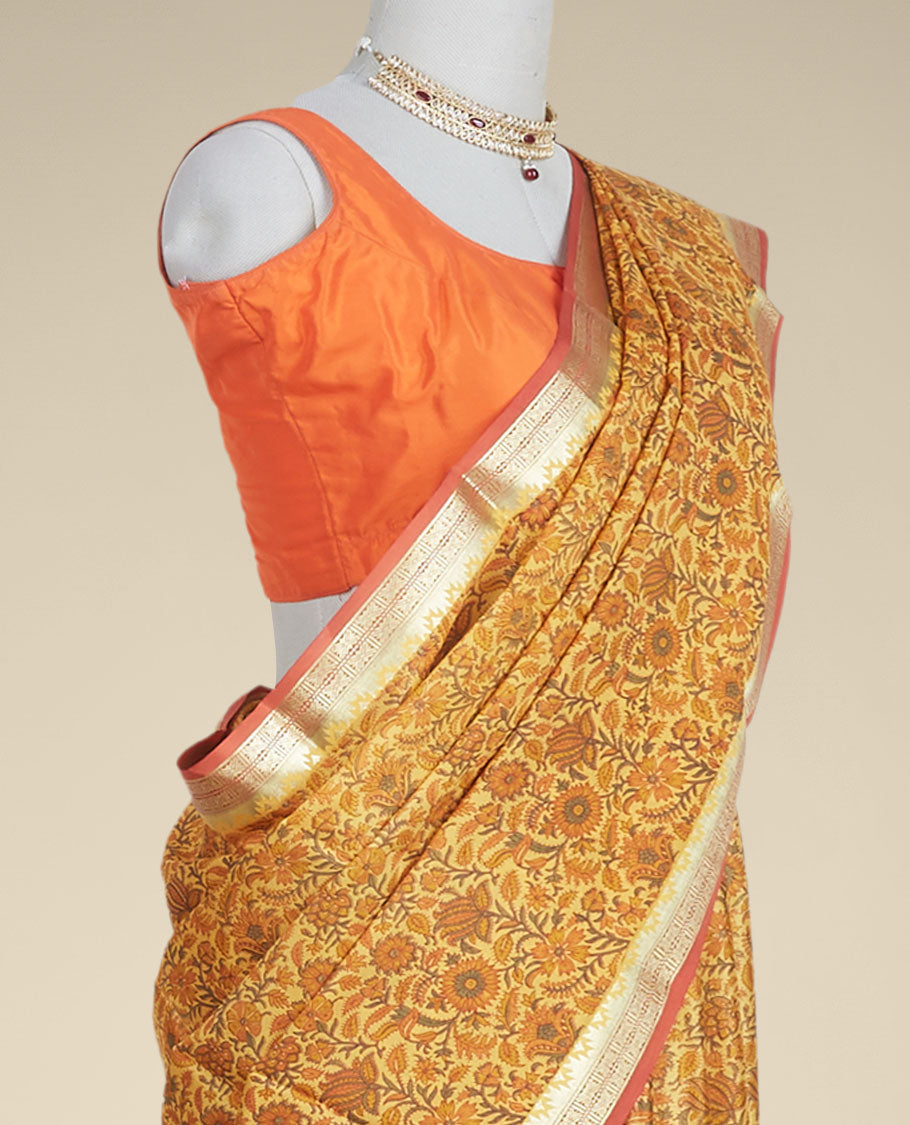 orange  floral printed silk saree with contrast intricate zari design border