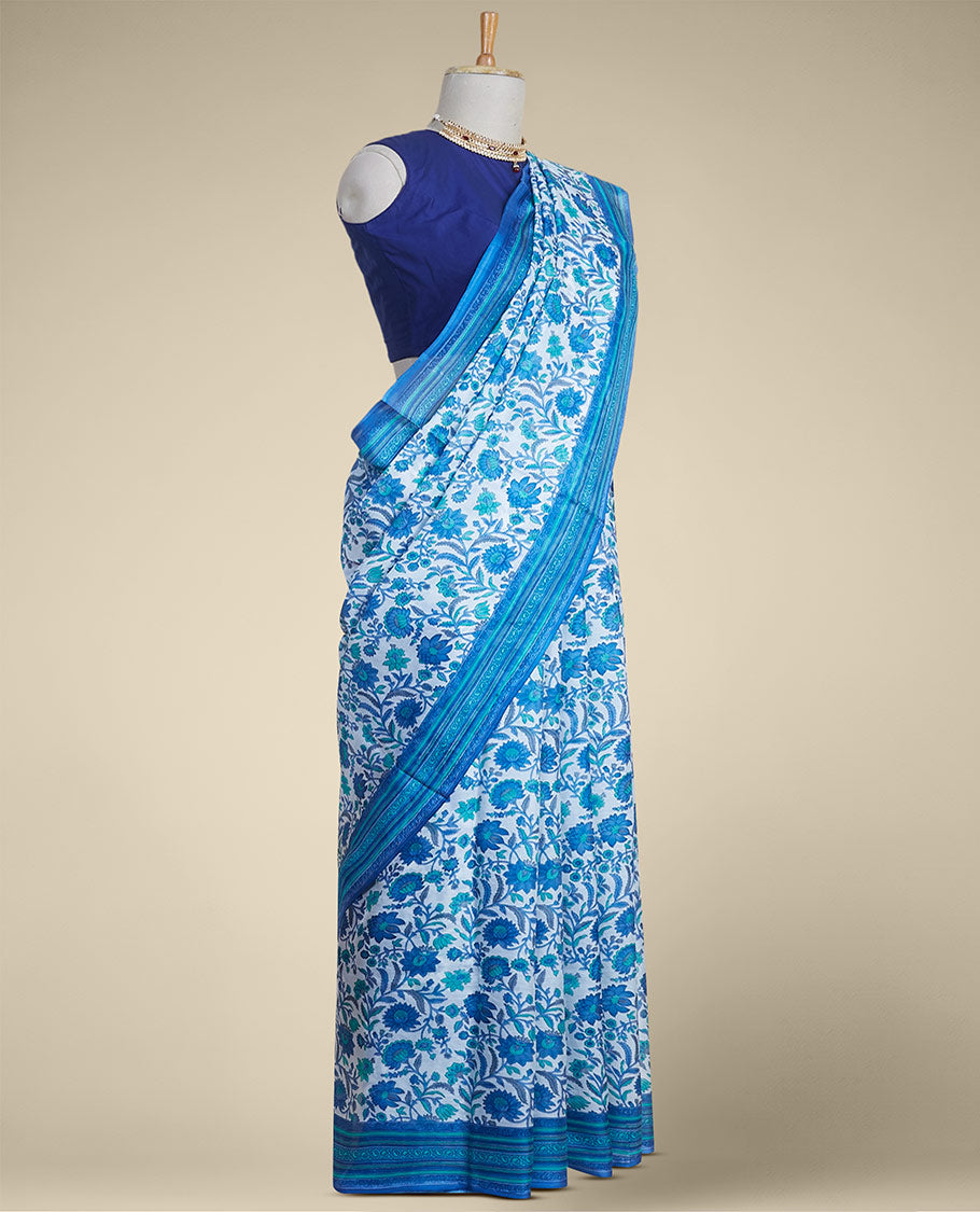 Blue floral vine design printed silk saree with contrast striped zari border