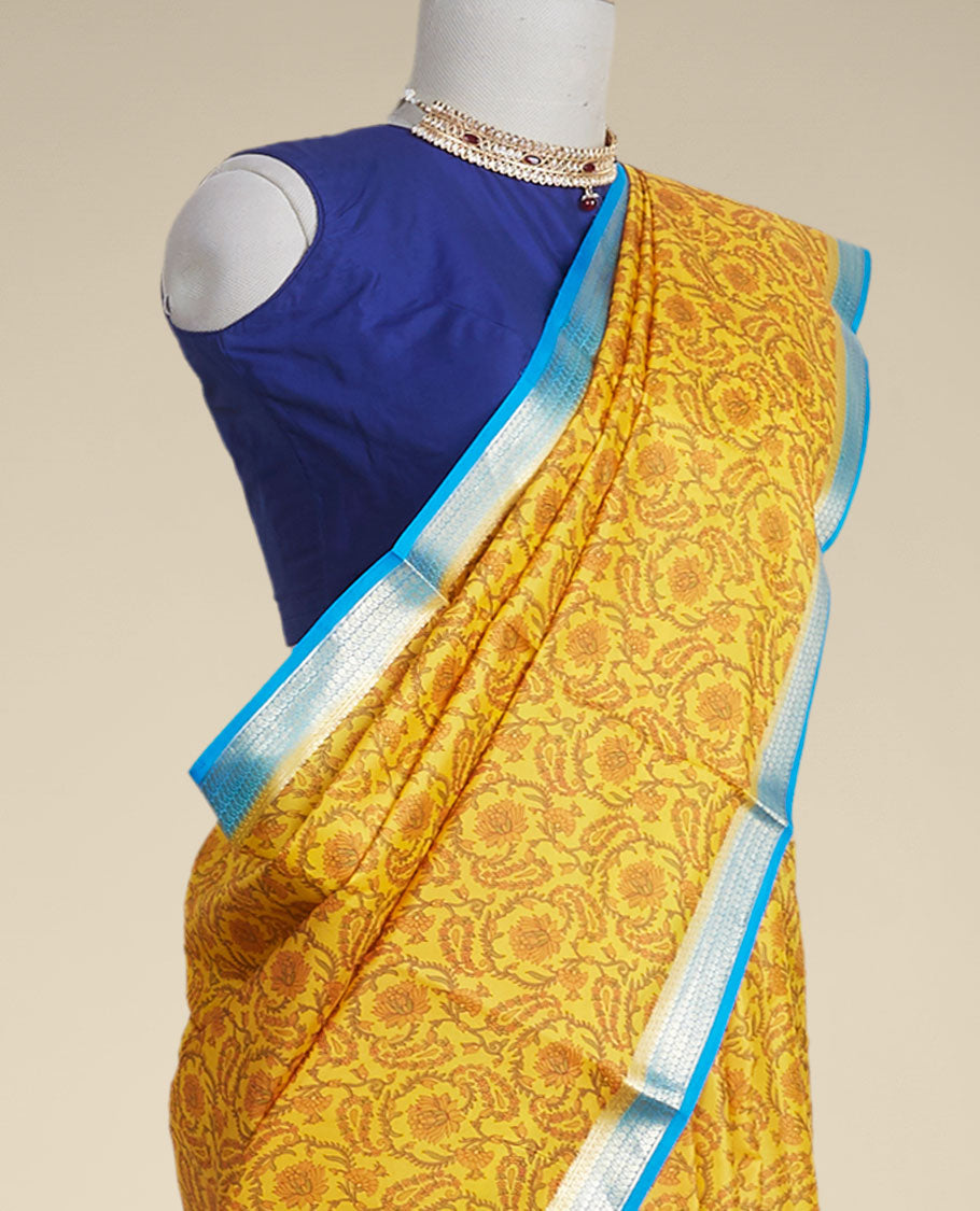 Yellow floral vine design printed silk saree with contrast striped zari border